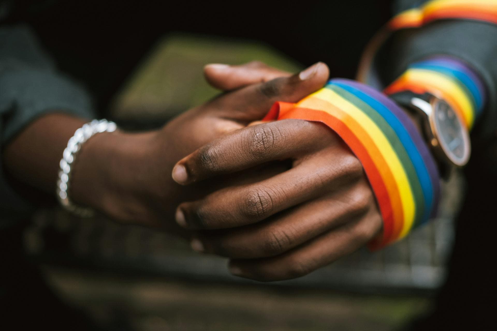 Diverse group of people joining hands in unity